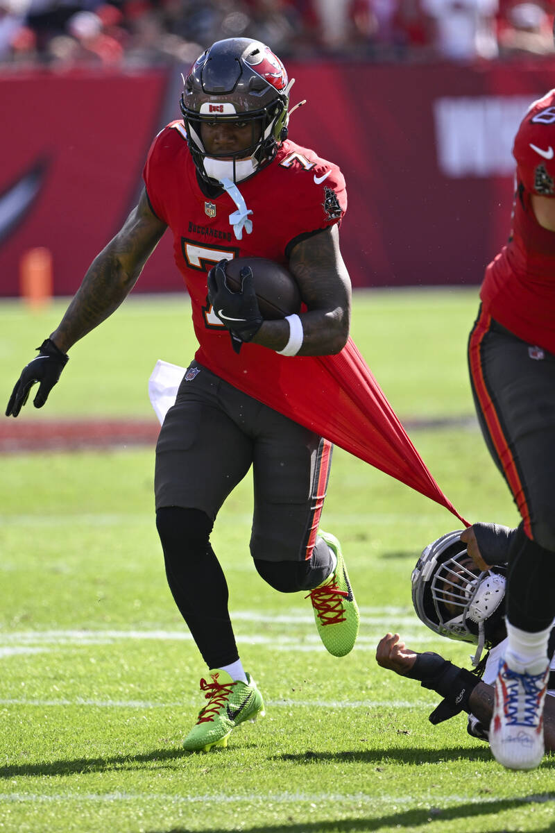 Tampa Bay Buccaneers running back Bucky Irving (7) runs against the Las Vegas Raiders during th ...