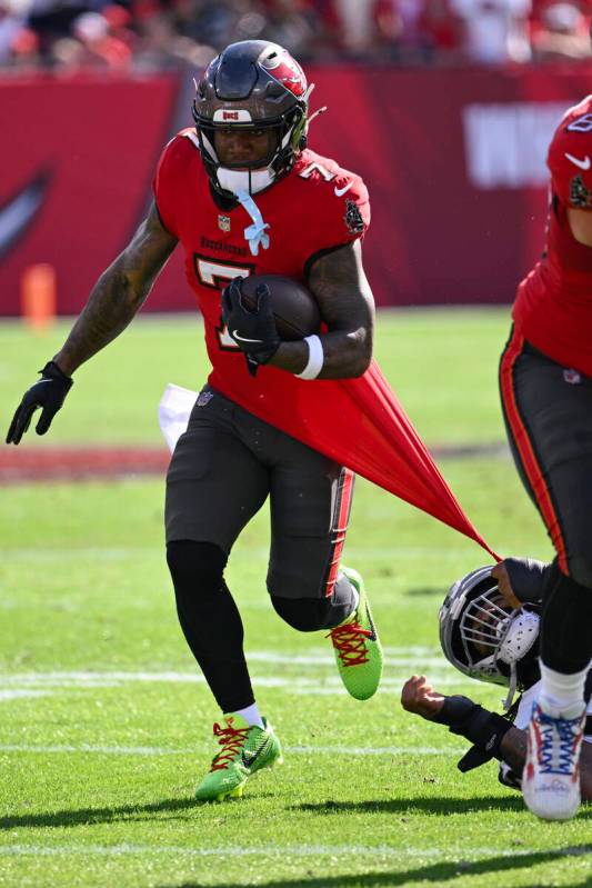 Tampa Bay Buccaneers running back Bucky Irving (7) runs against the Las Vegas Raiders during th ...