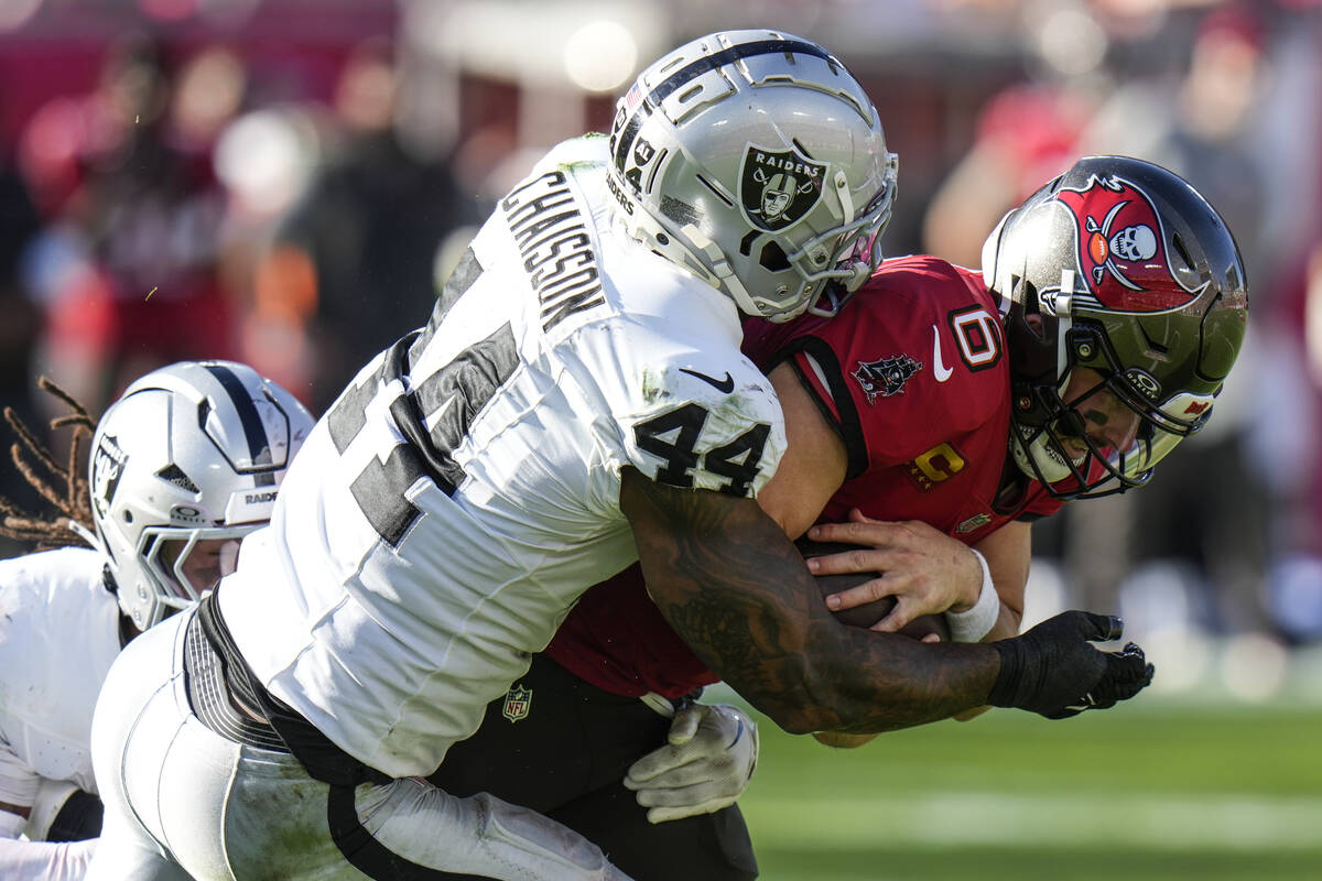 Las Vegas Raiders defensive end K'Lavon Chaisson (44) sacks Tampa Bay Buccaneers quarterback Ba ...