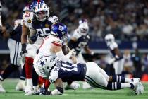 Dallas Cowboys defensive end Micah Parsons (11) sack the quarterback during an NFL football gam ...