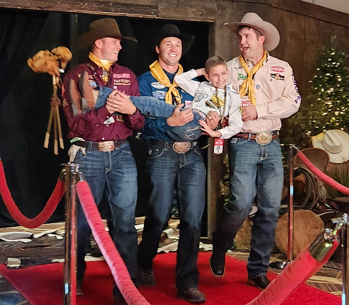 Steer wrestlers Hunter Koch, Rowdy Parrott and Tyler Waguespack walk their Golden Circle of Cha ...