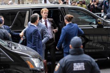 Daniel Penny, center, arrives at criminal court, Monday, Dec. 9, 2024, in New York. (AP Photo/S ...