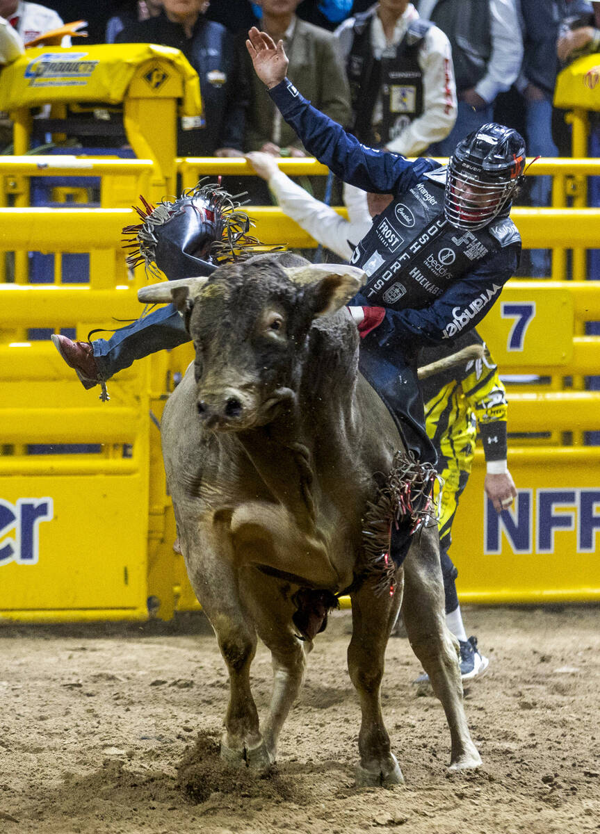 Bull Riding contestant Josh Frost rides Bill Fick Surprised to a winning score during National ...