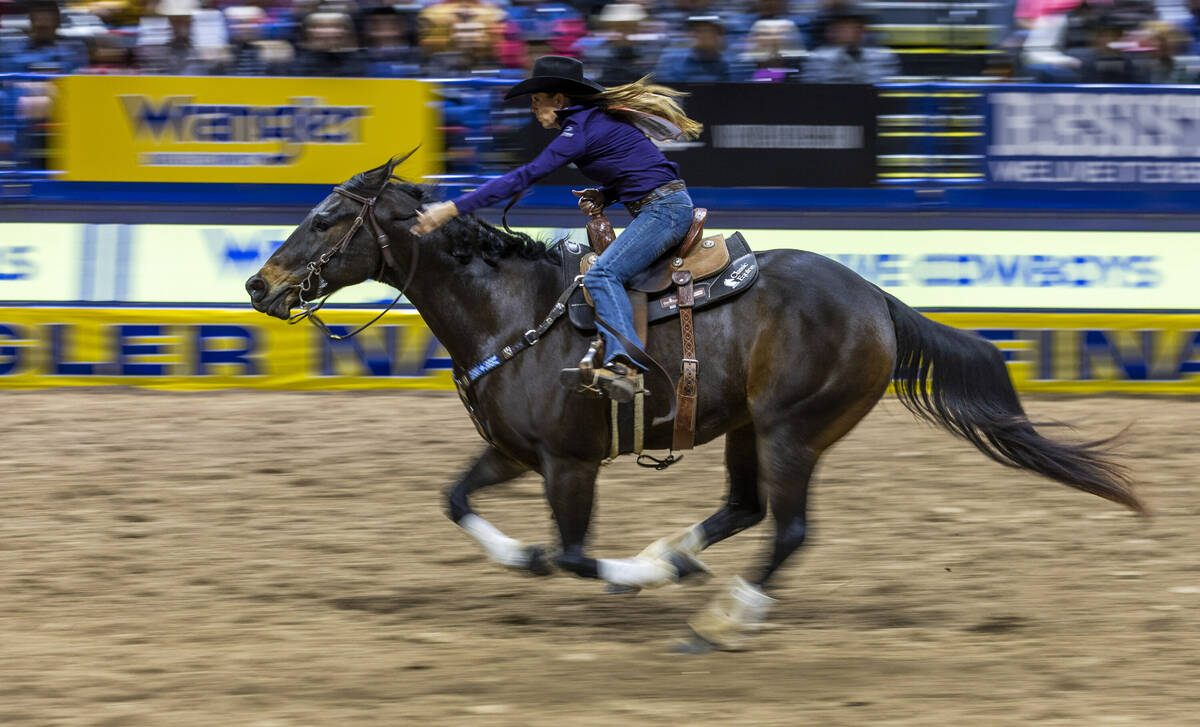 Barrel Racing contestant Kassie Mowry races for the finish line on her way to a winning time du ...