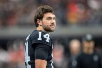 Raiders quarterback Carter Bradley (14) on the sideline before an NFL game against the Kansas C ...