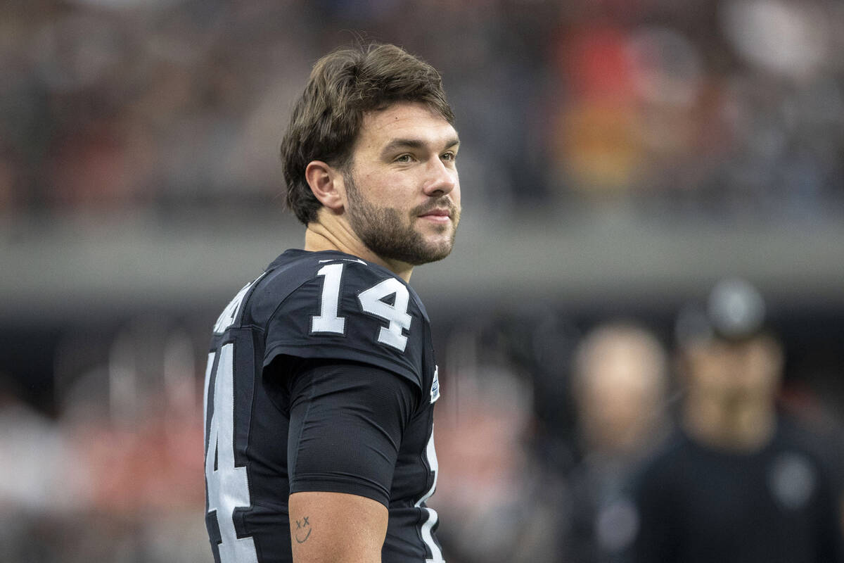 Raiders quarterback Carter Bradley (14) on the sideline before an NFL game against the Kansas C ...