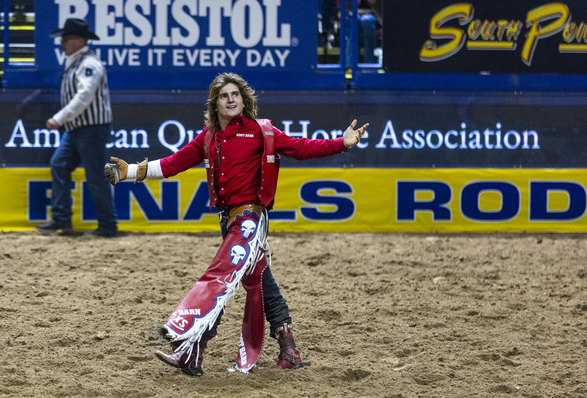 Bare Back Riding contestant Rocker Steiner celebrates after riding Tator Tot to a winning score ...