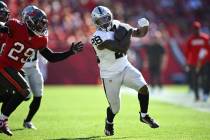 Las Vegas Raiders running back Sincere McCormick (28) rushes for yardage as Tampa Bay Buccaneer ...