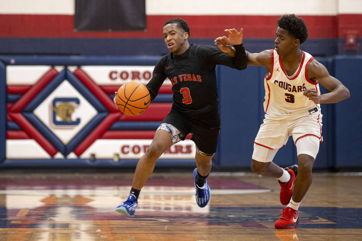 Las Vegas senior Tayshaun Jackson (3) attempts to dribble around Coronado senior Jalen St. Clai ...