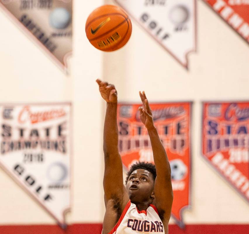 Coronado senior Jalen St. Clair attempts a three-point shot during the high school basketball g ...