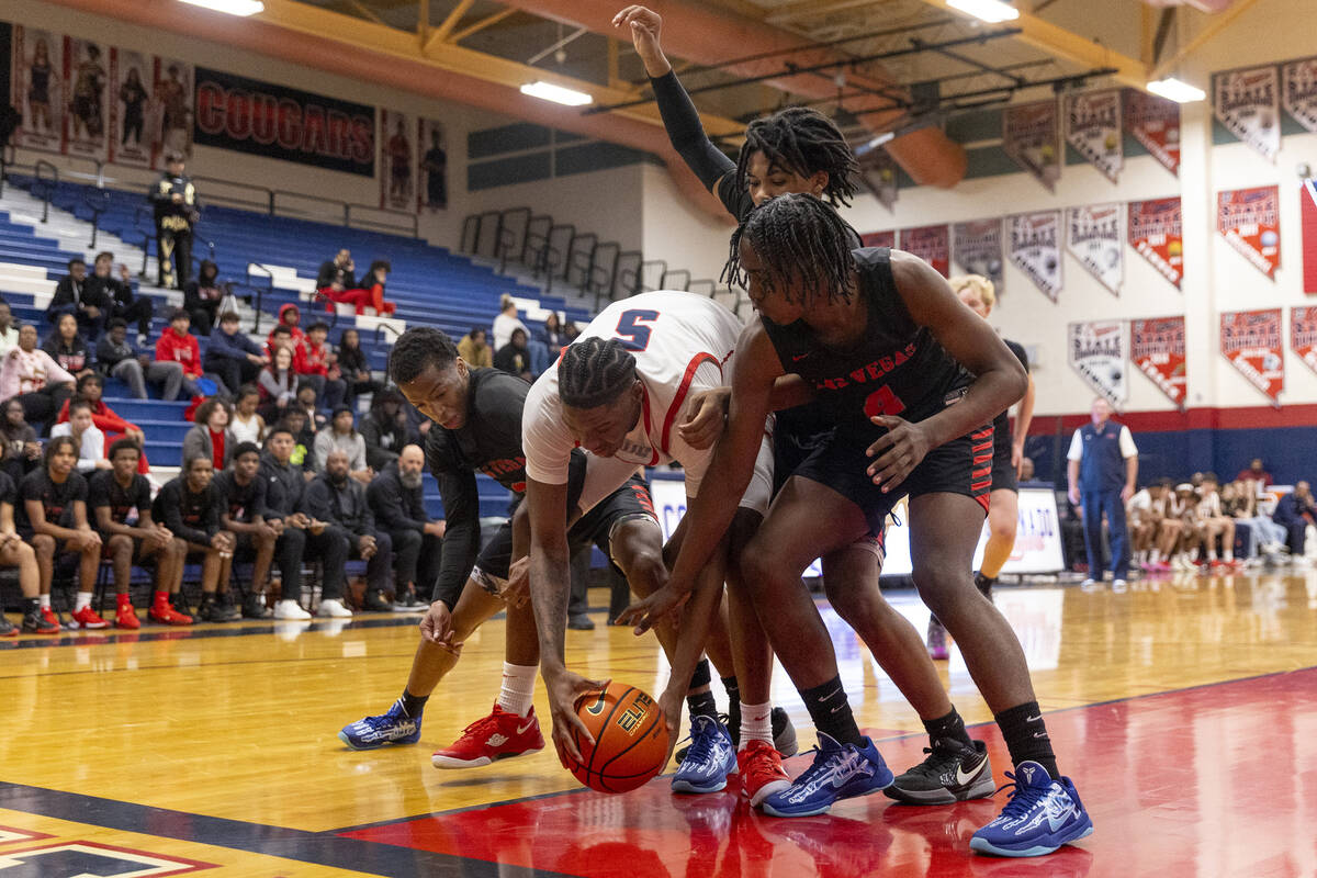 Coronado senior Lantz Stephenson (5) is surrounded by Las Vegas players while attempting to reb ...