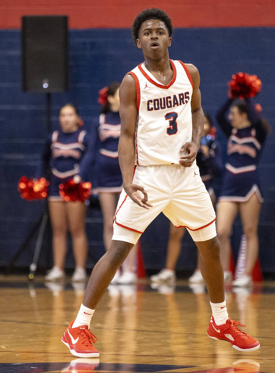 Coronado senior Jalen St. Clair (3) celebrates a three-point shot during the high school basket ...