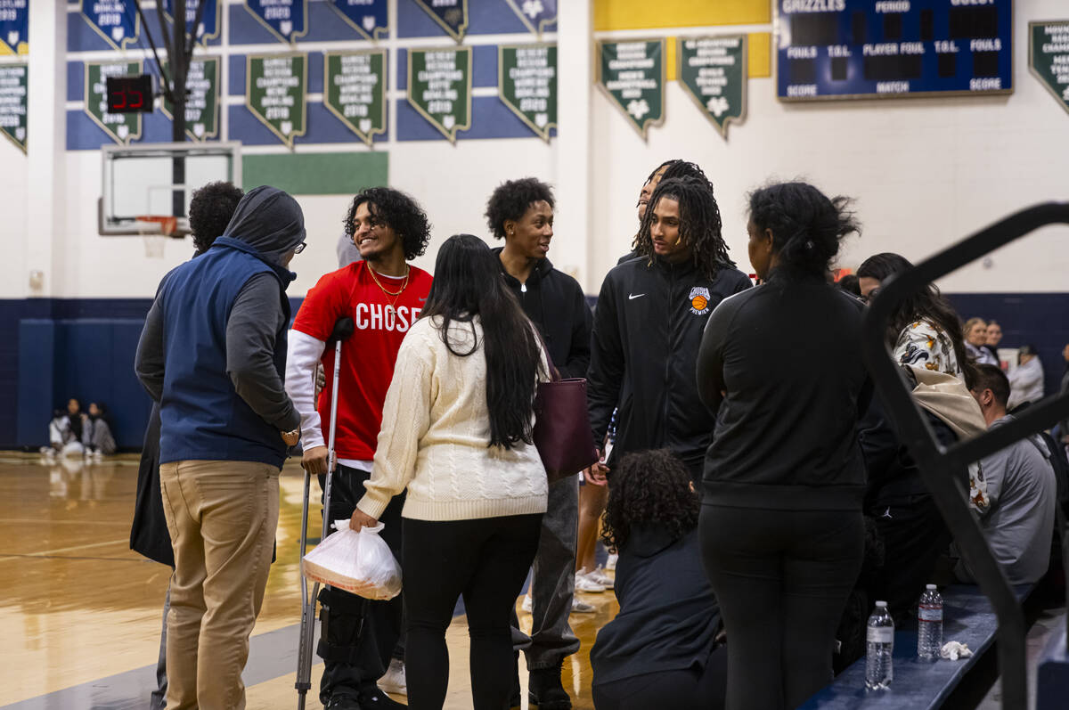 Relatives and loved ones of community figure and basketball coach Abdul Adem are seen during a ...