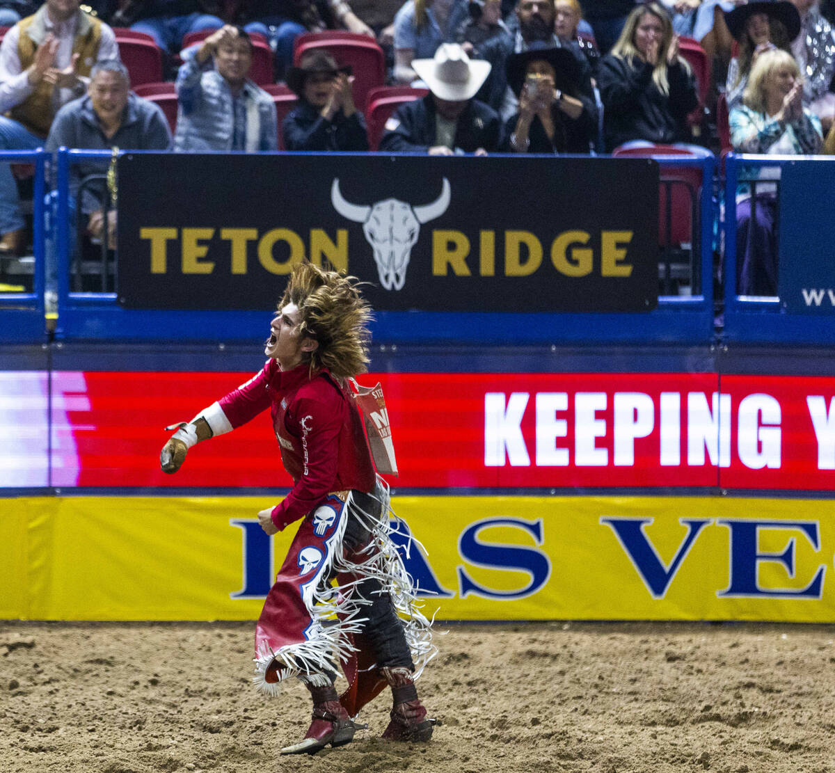 Bareback riding contestant Rocker Steiner celebrates after riding Tator Tot to a winning score ...