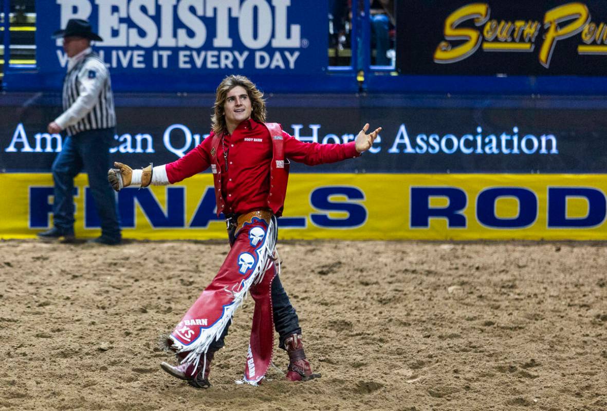 Bareback riding contestant Rocker Steiner celebrates after riding Tator Tot to a winning score ...