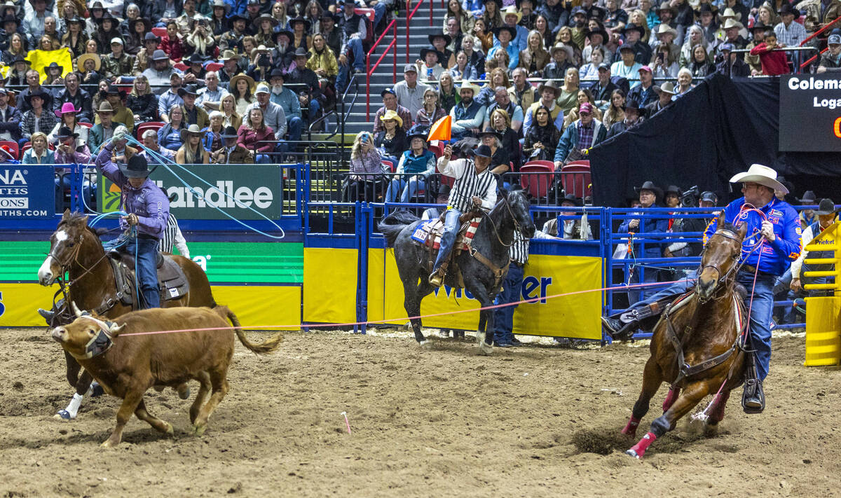 Team Roping Header Coleman Proctor and Heeler Logan Medlin bear down to rope their calf for a w ...