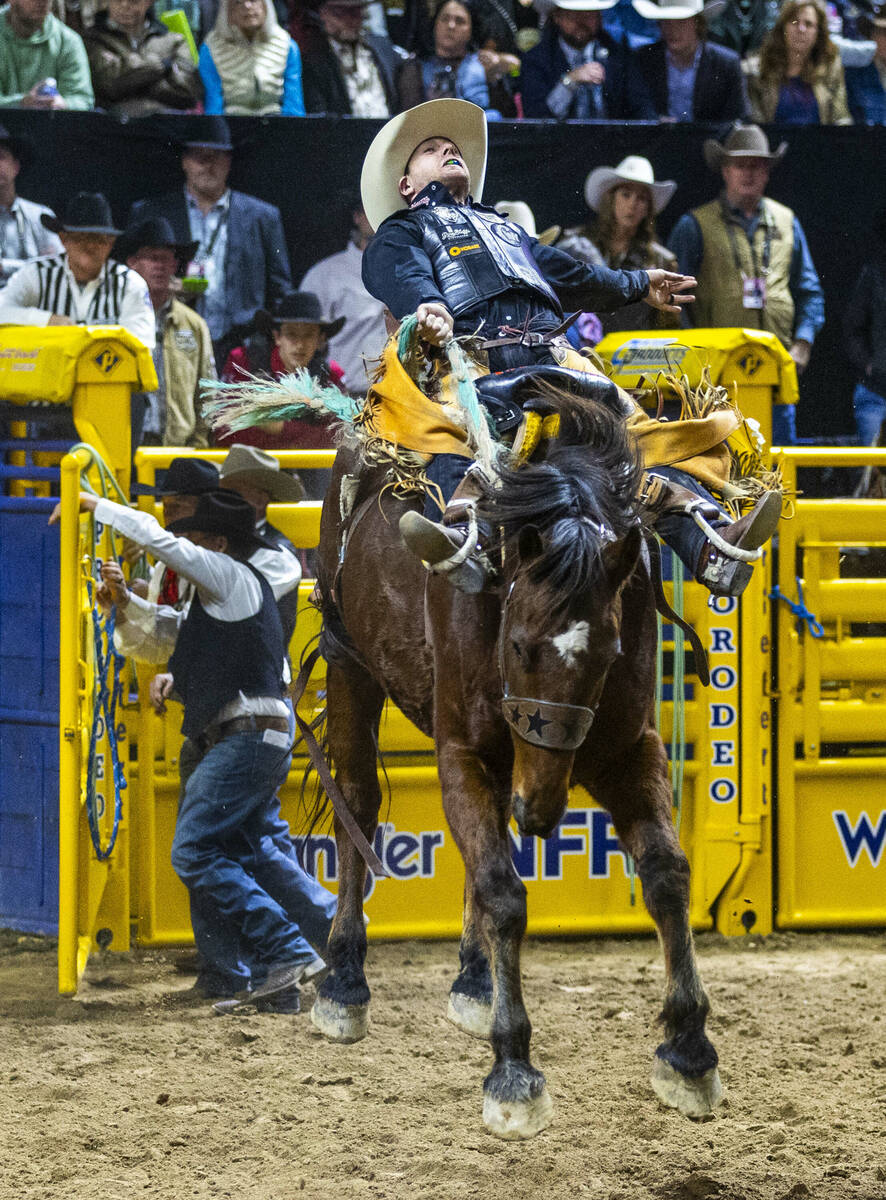 Saddle Bronc Riding contestant Brody Cress rides Wall Street to a winning score during National ...