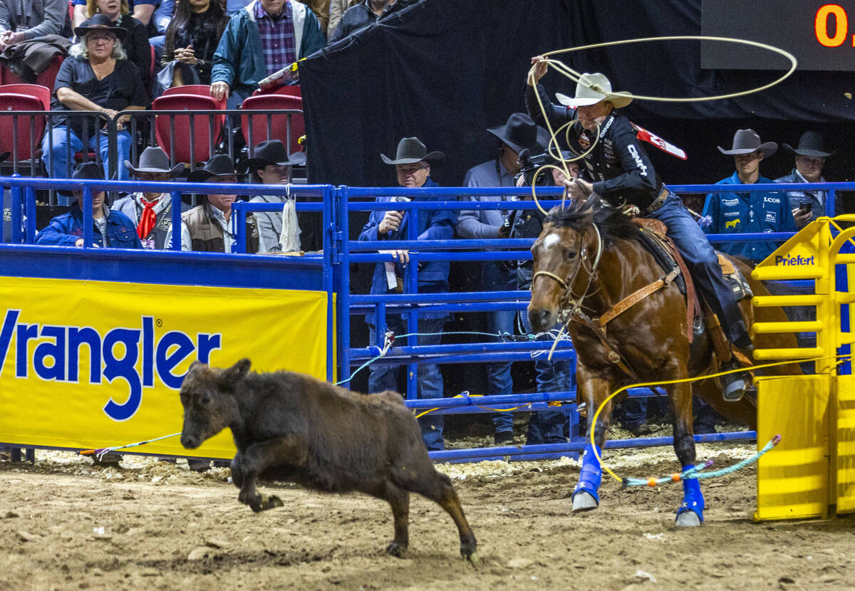 Tie-Down Roping contestant Dylan Hancock eyes his calf on the way to winning time during Nation ...