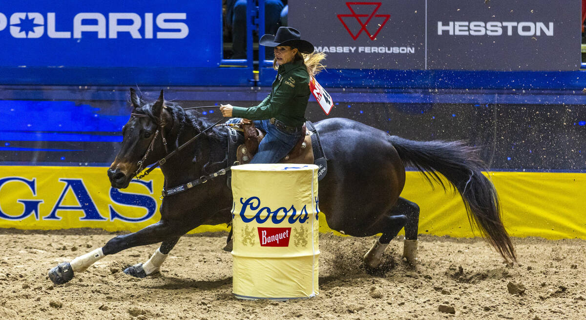 Barrel Racing contestant Kassie Mowry rides to a new event time record during National Finals R ...