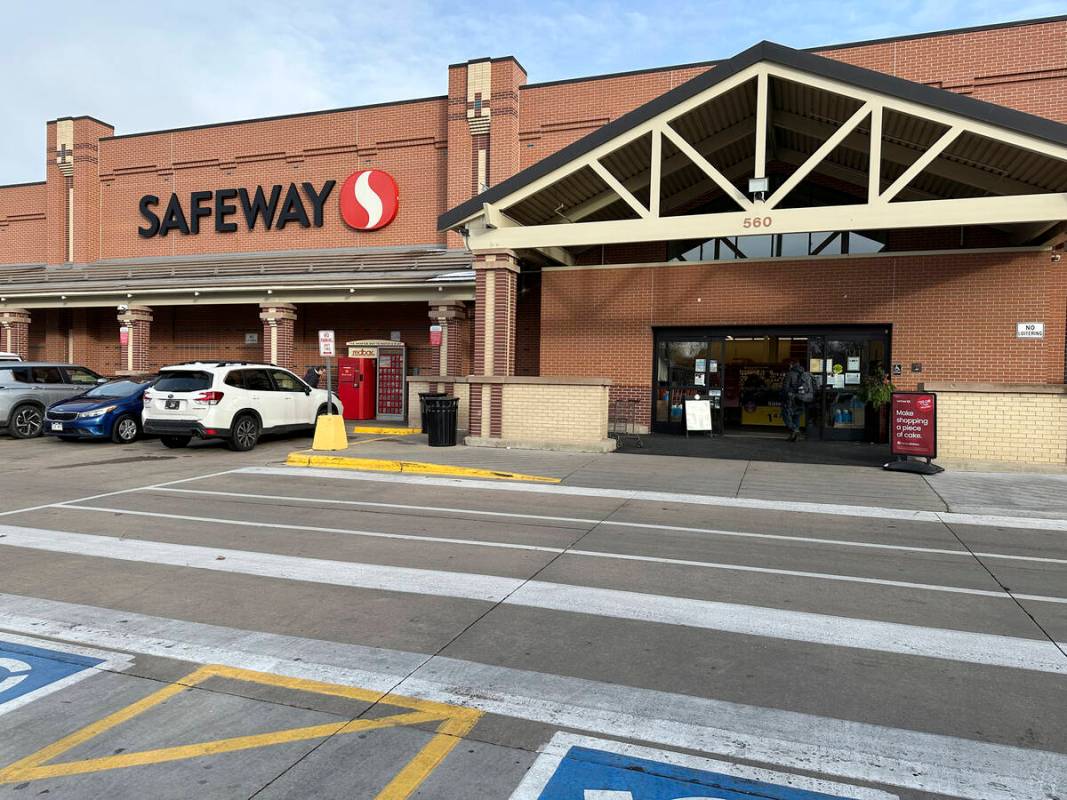 A shopper heads into a Safeway store, which is part of the Albertson's grocery chain, Tuesday, ...