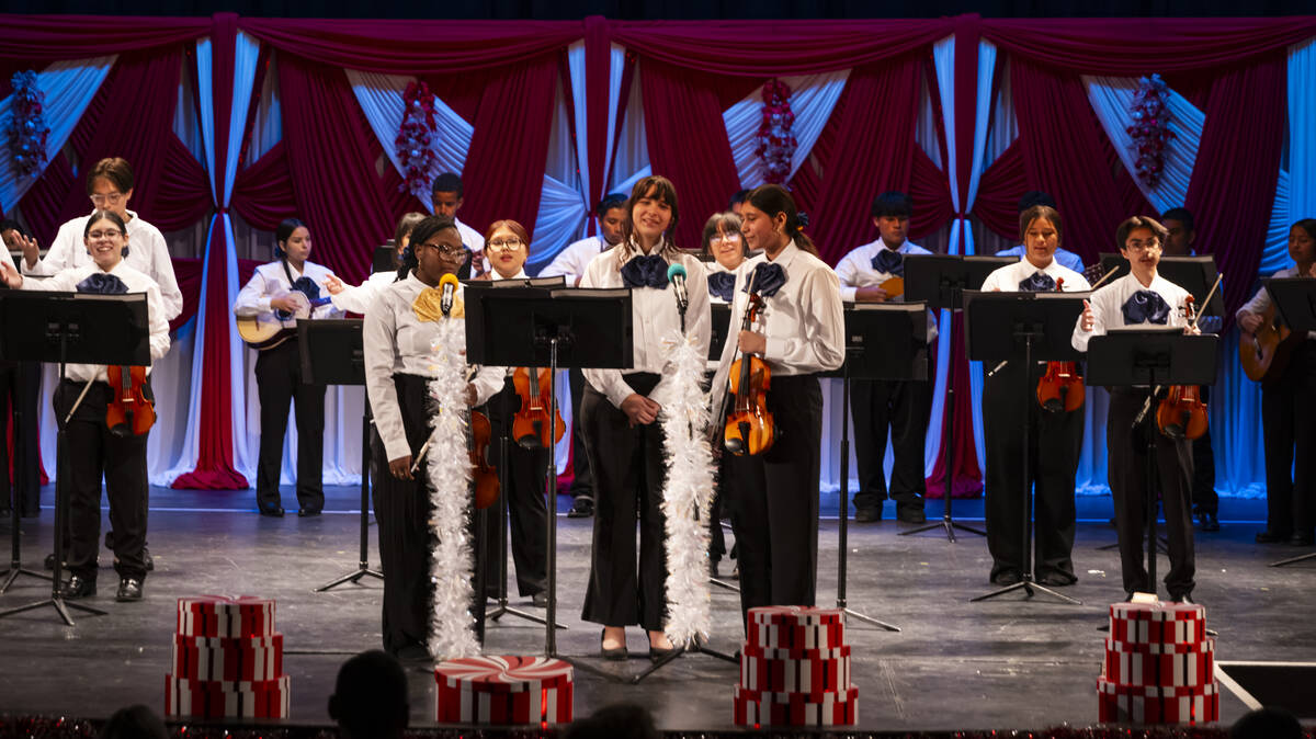 Elyzabeth Adair, center, sings with her classmates in the newly established mariachi classes at ...