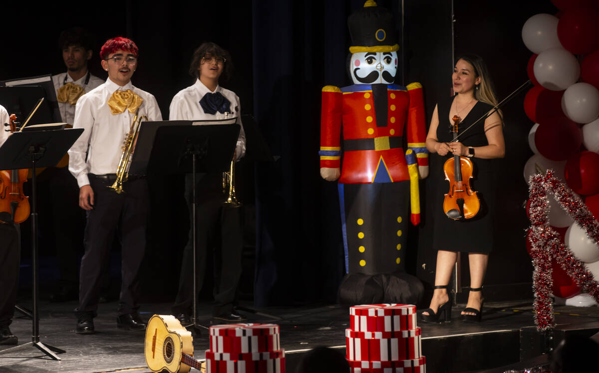 Elizabeth Mendez, director of the mariachi program at Cheyenne High School, right, looks on dur ...