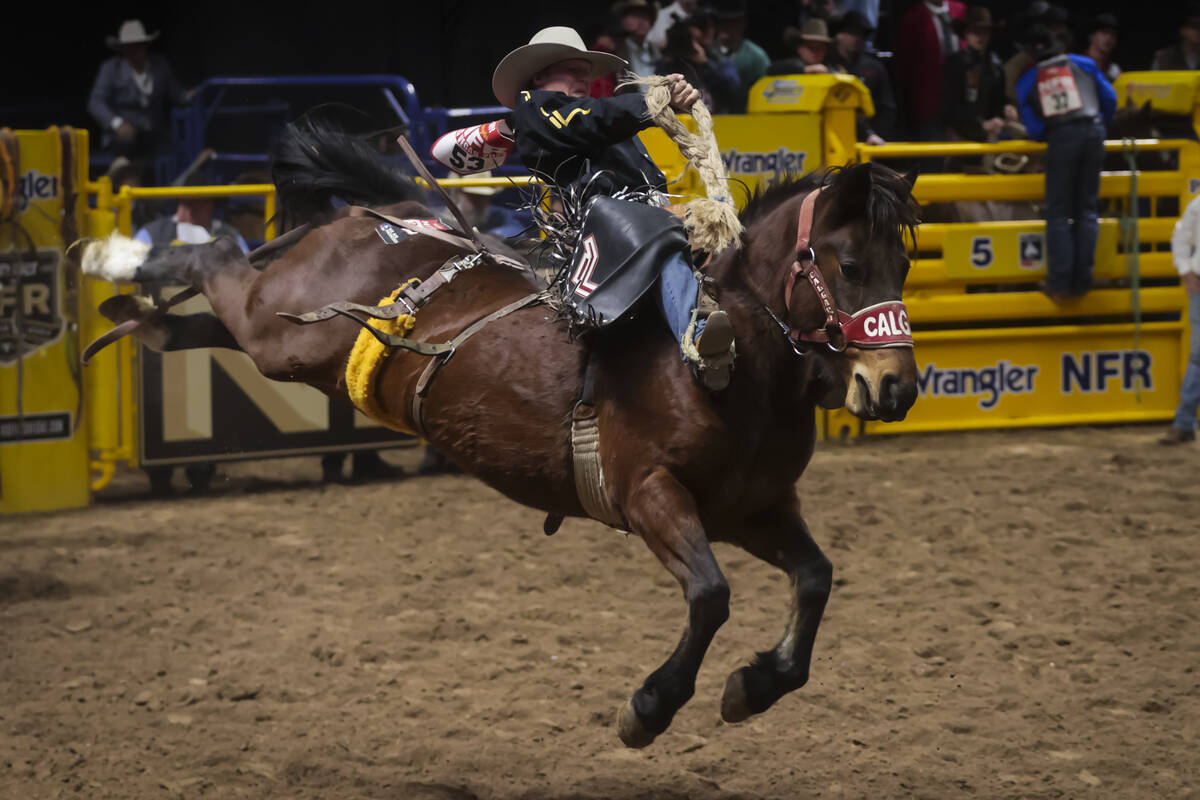 Dawson Hay competes in saddle bronc riding during the 8th go-round of the National Finals Rodeo ...