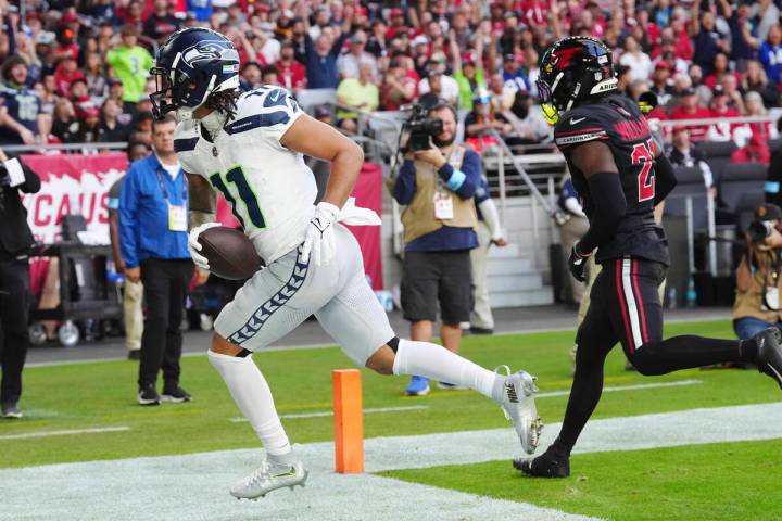 Seattle Seahawks wide receiver Jaxon Smith-Njigba (11) beats Arizona Cardinals cornerback Garre ...