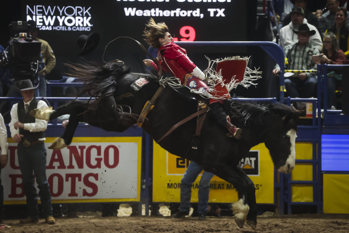 Rocker Steiner competes in bareback riding during the 8th go-round of the National Finals Rodeo ...