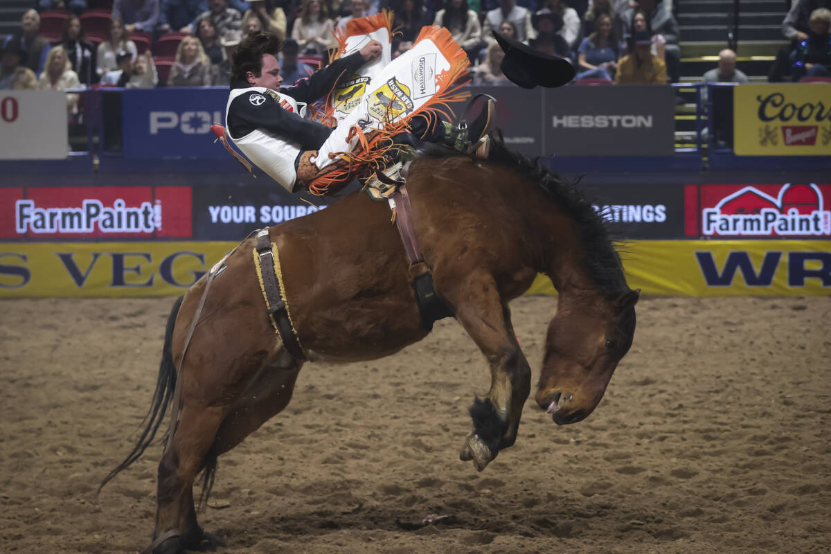 Cole Reiner competes in bareback riding during the 8th go-round of the National Finals Rodeo at ...