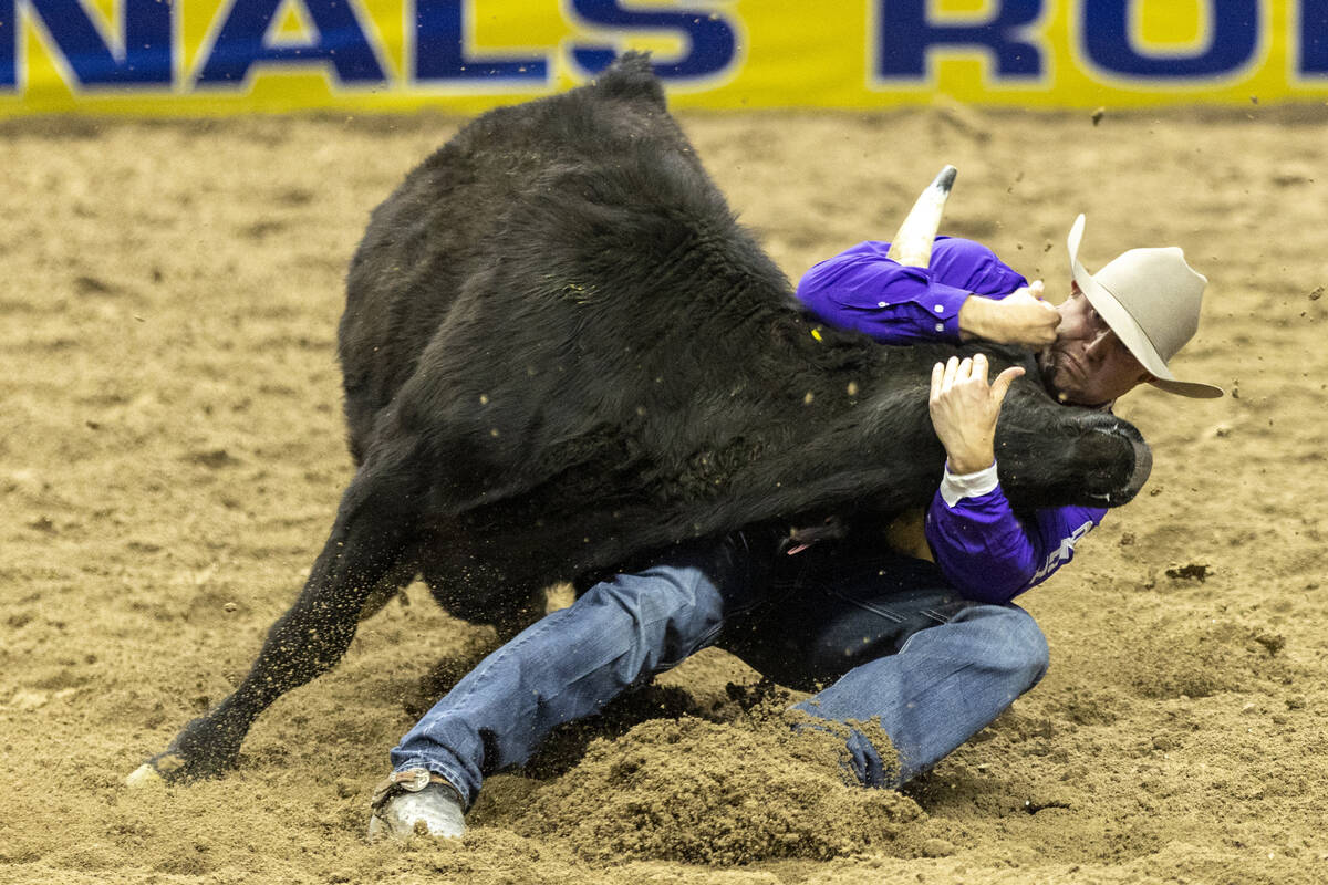 Tyler Waguespack pulls on a steer in the steer wrestling event during day nine of the National ...