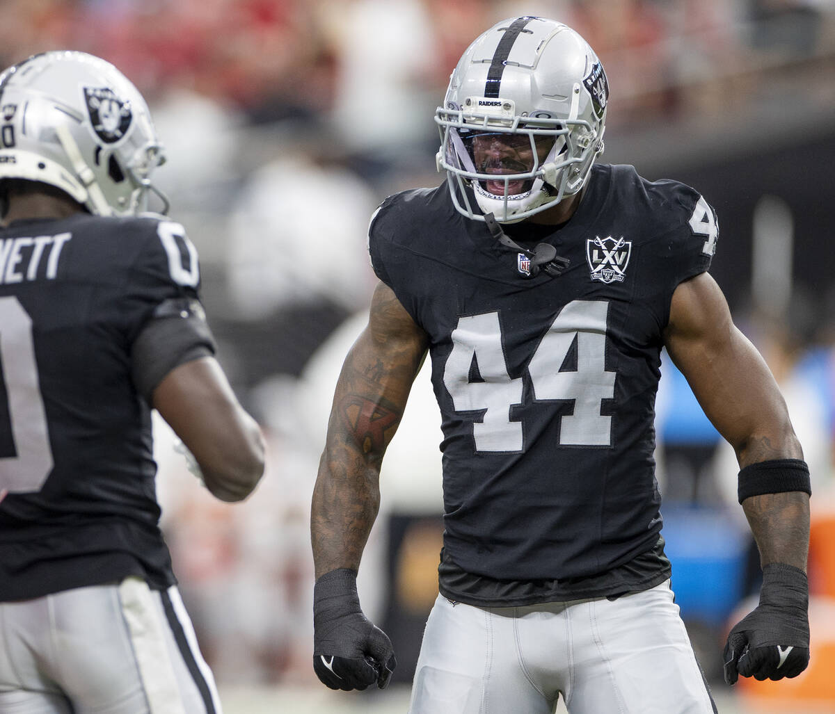 Raiders defensive end K'Lavon Chaisson (44) reacts after a big play during the first half of th ...