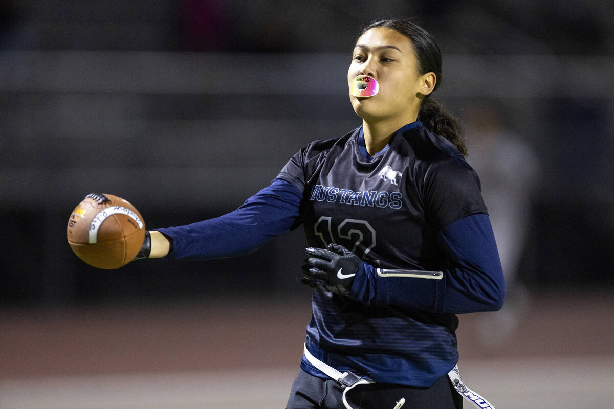 Shadow Ridge junior Jaylani Palmer (12) reaches out to score a touchdown during the high school ...