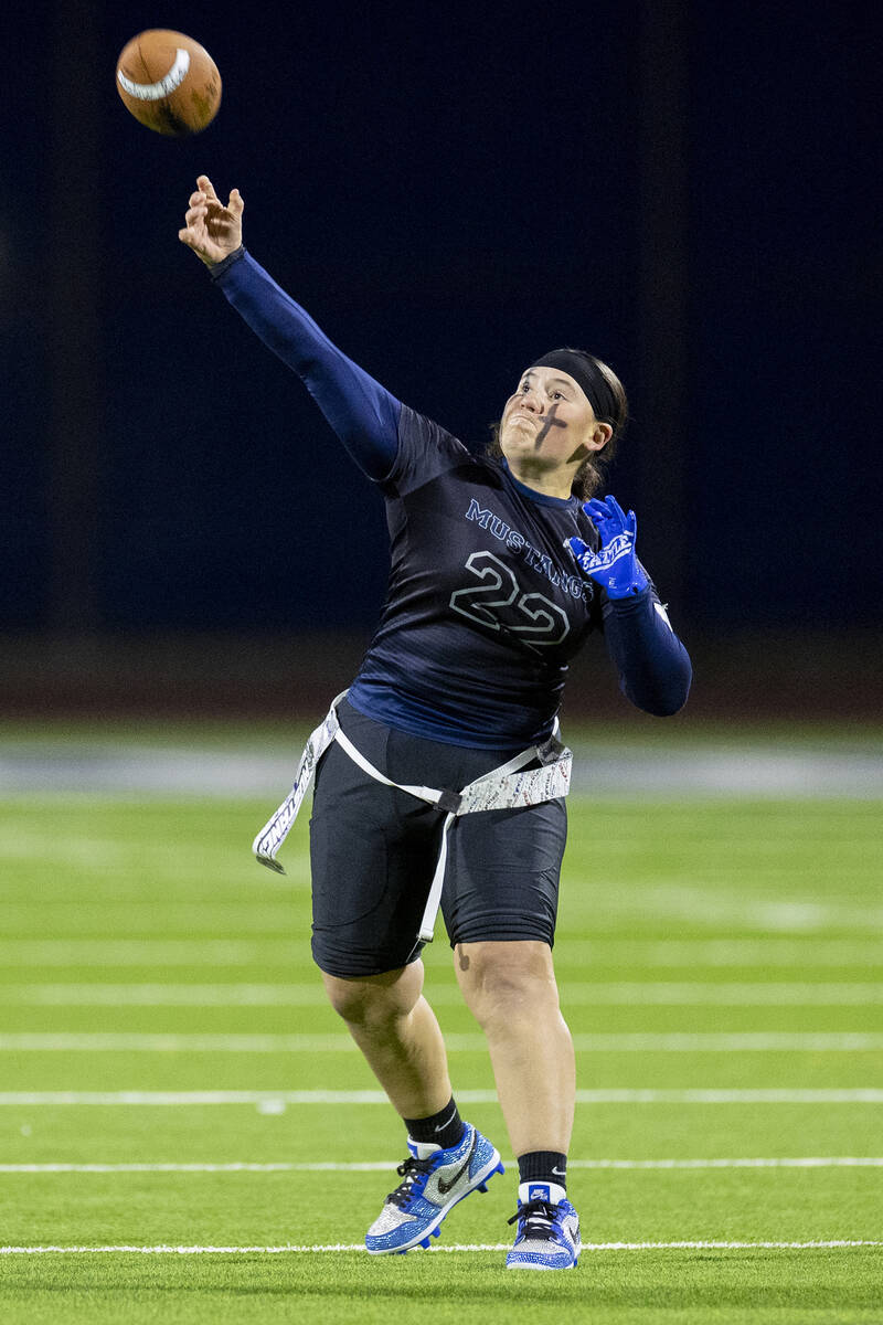 Shadow Ridge senior Aubree Davis (22) throws the ball during the high school flag football game ...