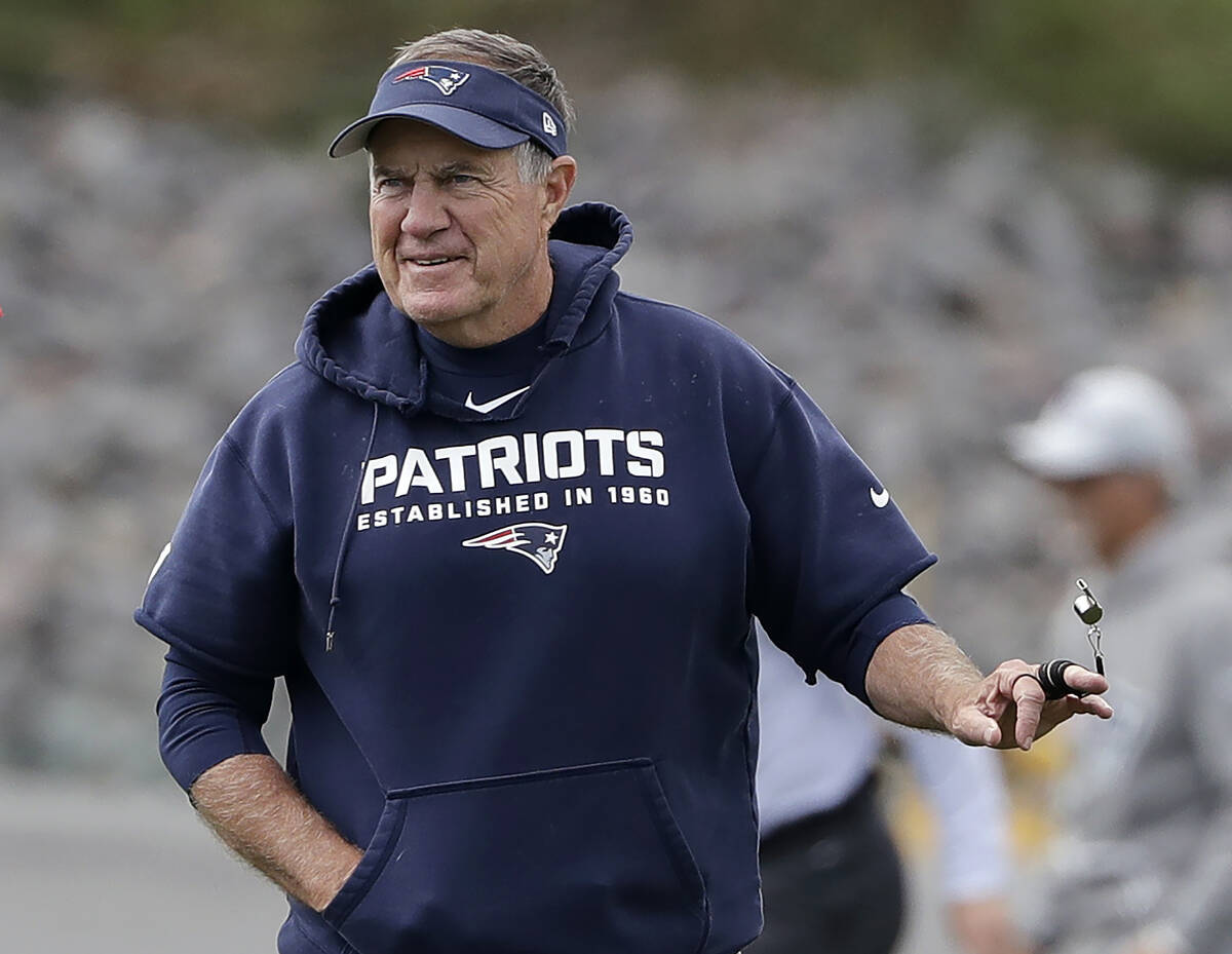 New England Patriots head coach Bill Belichick twirls his whistle during an NFL football practi ...