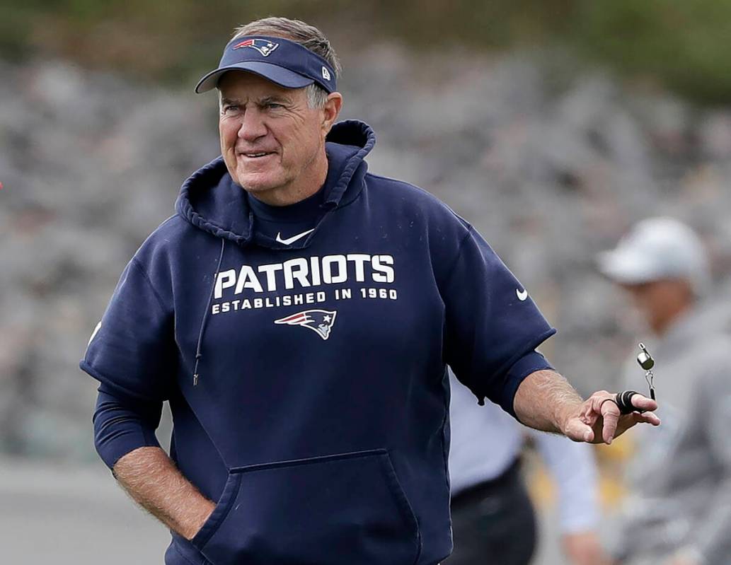 New England Patriots head coach Bill Belichick twirls his whistle during an NFL football practi ...