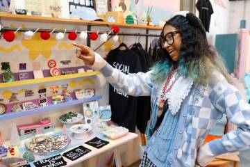 Kumei Norwood, 16, an entrepreneur and owner of Tofu Tees, an apparel and gift shop in Ferguson ...