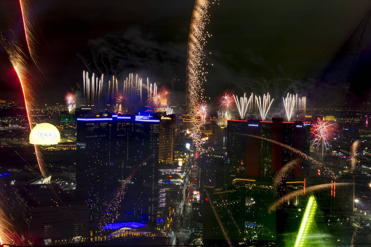 Fireworks erupt over the Las Vegas Strip as part of New Years Eve festivities across the city f ...