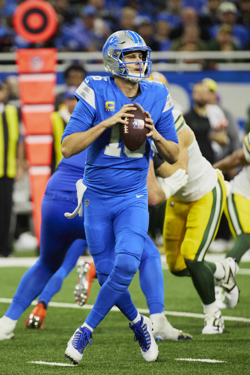 Detroit Lions quarterback Jared Goff (16) drops back to pass against the Green Bay Packer durin ...