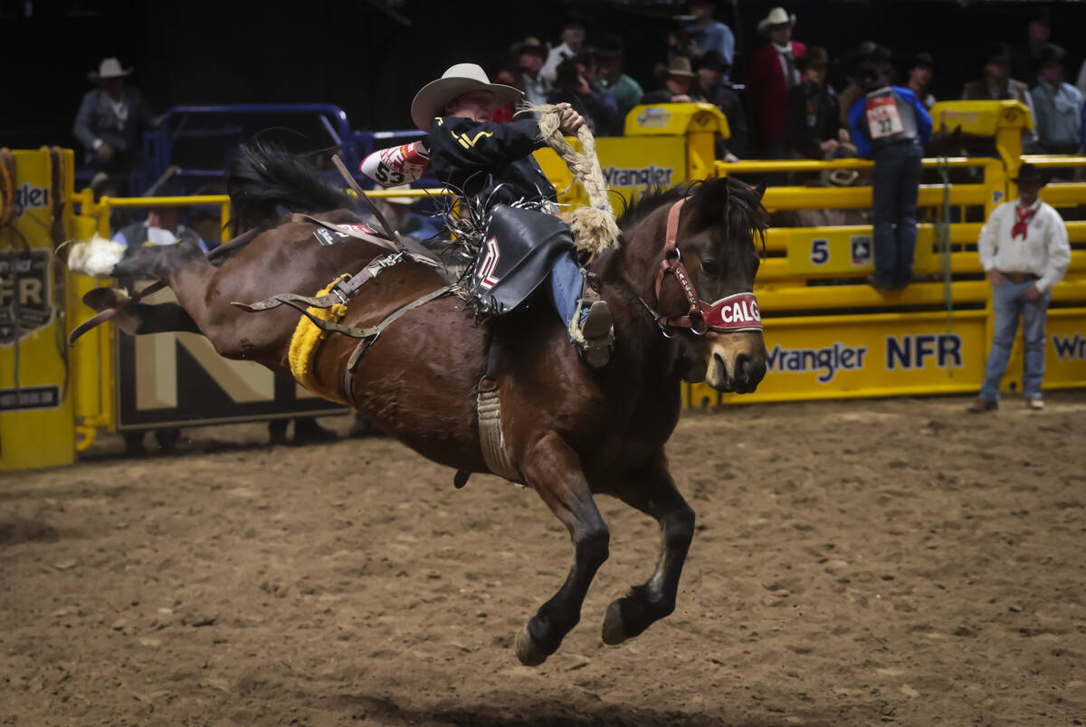 Dawson Hay competes in saddle bronc riding during the 8th go-round of the National Finals Rodeo ...