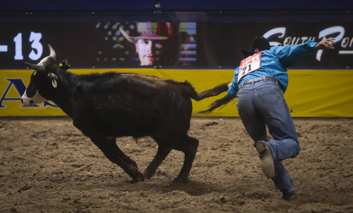 Jesse Brown comes up short in steer wrestling during the 8th go-round of the National Finals Ro ...