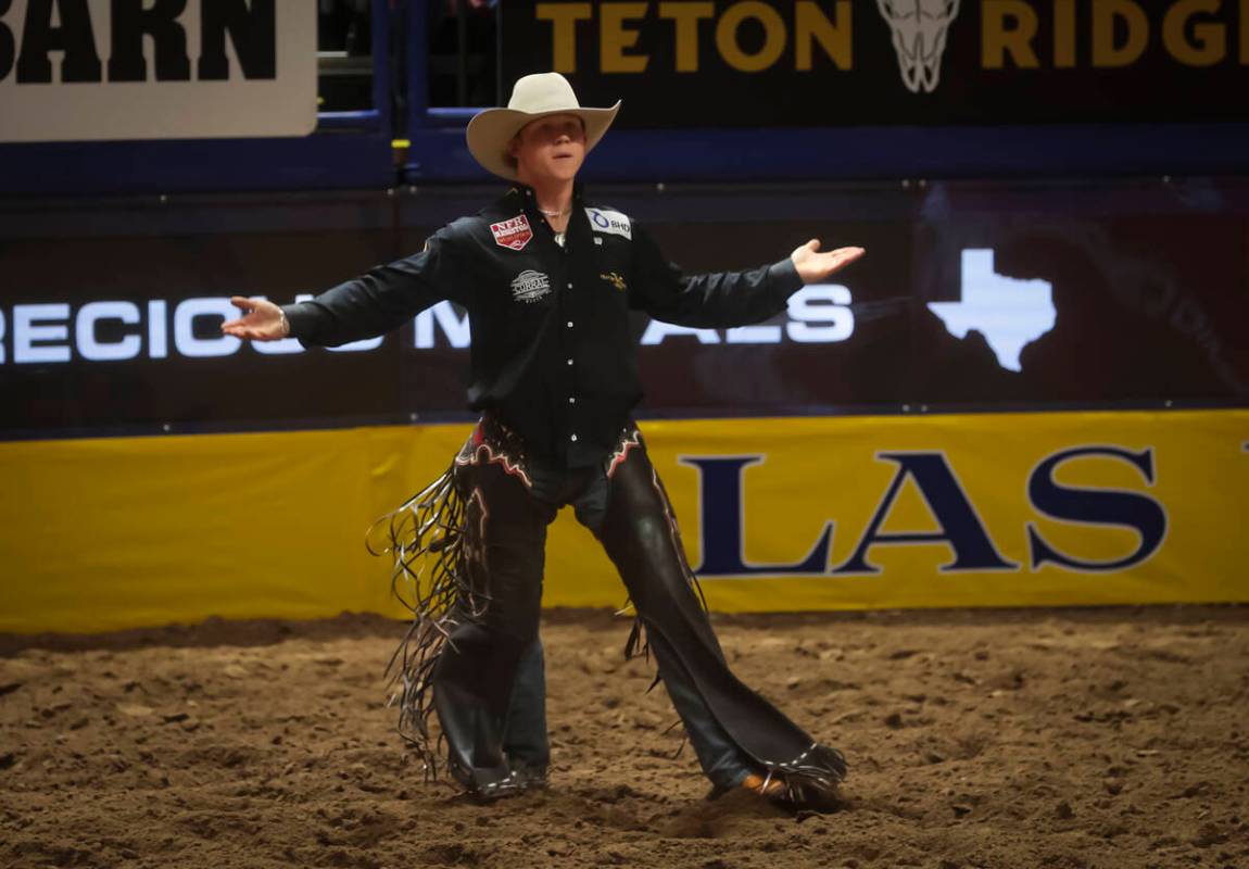 Dawson Hay reacts after competing in saddle bronc riding during the 8th go-round of the Nationa ...