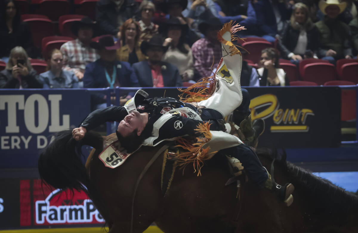 Cole Reiner competes in bareback riding during the 8th go-round of the National Finals Rodeo at ...