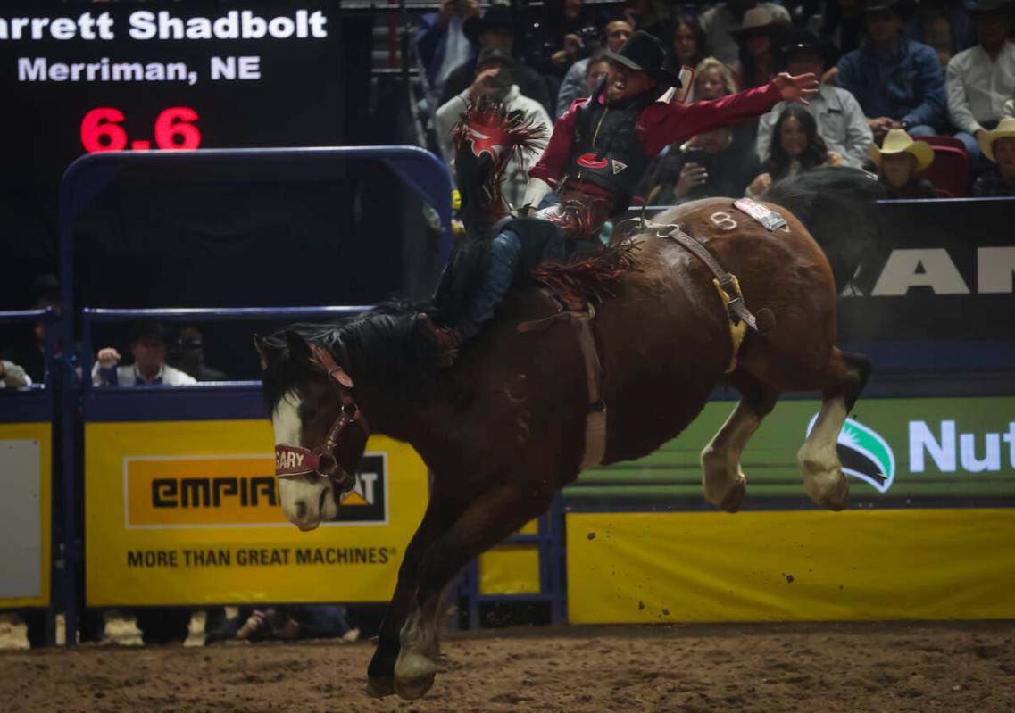 Garrett Shadbolt competes in bareback riding during the 8th go-round of the National Finals Rod ...