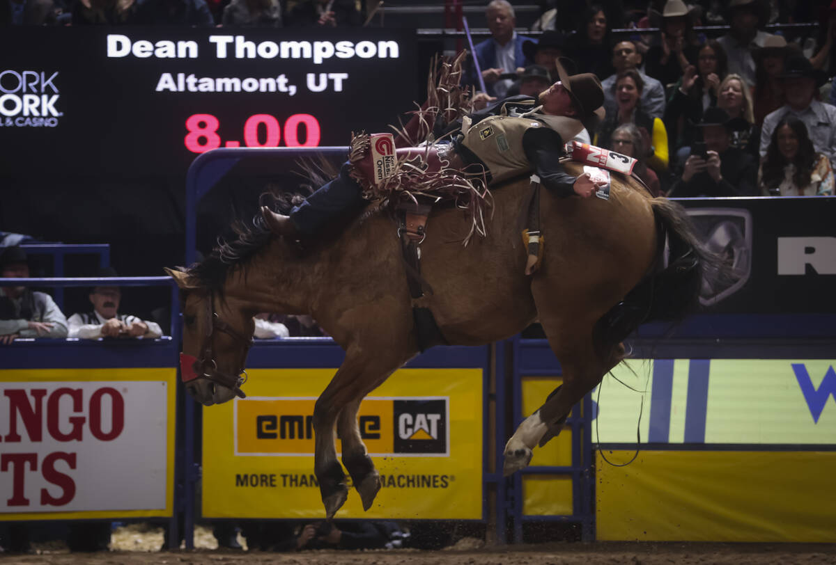 Dean Thompson competes in bareback riding during the 8th go-round of the National Finals Rodeo ...