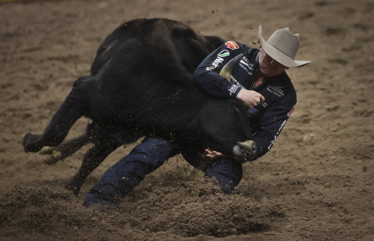 Dakota Eldridge competes in steer wrestling during the 8th go-round of the National Finals Rode ...