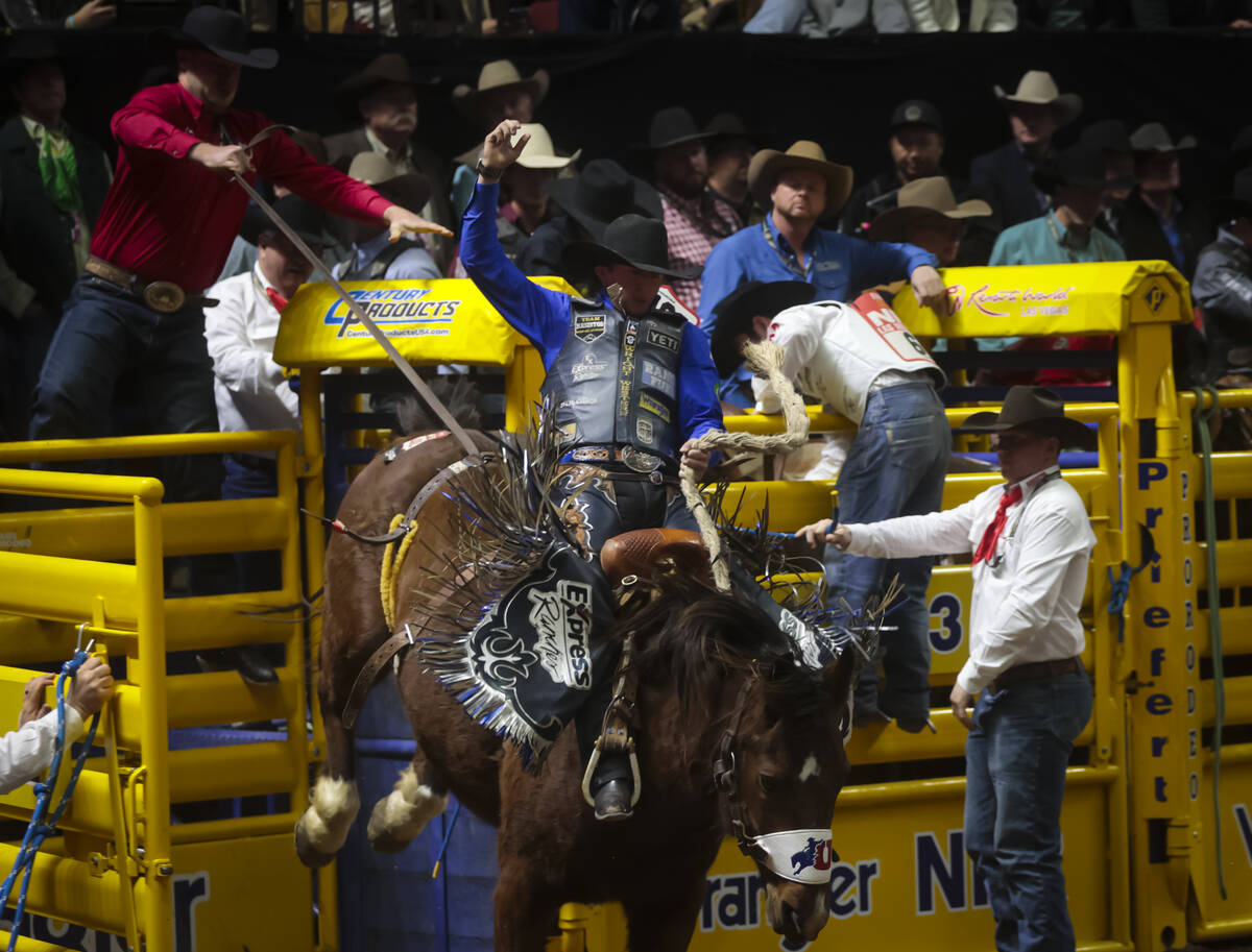 Statler Wright competes in saddle bronc riding during the 8th go-round of the National Finals R ...