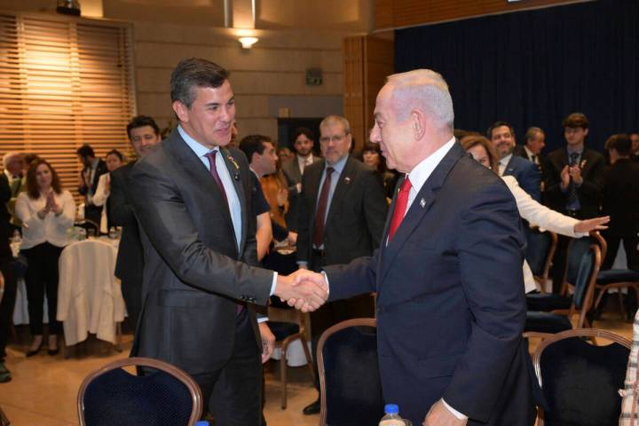 Paraguay's President Santiago Pena, left, shakes hands with Israeli Prime Minister Benjamin Net ...