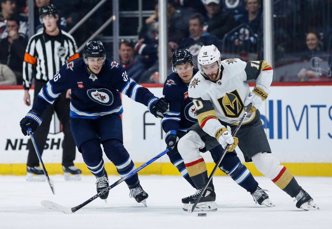 Winnipeg Jets' Morgan Barron (36) and Vladislav Namestnikov (7) defends against Vegas Golden Kn ...