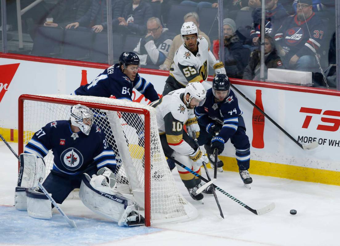 Vegas Golden Knights' Shea Theodore (27), Mark Stone (61), Victor Olofsson (95) and Tomas Hertl ...